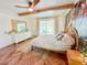 Cozy bedroom featuring beamed ceiling, stylish accent wall, and ample natural light at 27 Fitzroy Dr, Charleston, SC 29414
