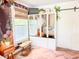 Bedroom with herringbone floors, accent wall, and storage wardrobe at 27 Fitzroy Dr, Charleston, SC 29414