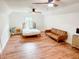 Well-lit bedroom offering two ceiling fans, neutral paint, and hardwood flooring at 27 Fitzroy Dr, Charleston, SC 29414