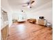 Bright bedroom showcasing hardwood floors, ceiling fans, and modern furniture at 27 Fitzroy Dr, Charleston, SC 29414