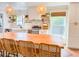 Kitchen features a large center island with wood countertop, bar seating, modern appliances, and ample counterspace at 27 Fitzroy Dr, Charleston, SC 29414