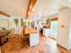 Well-designed kitchen with a large island, herringbone floors, stainless steel appliances, and wood beam accents at 27 Fitzroy Dr, Charleston, SC 29414