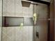 Close up of a modern shower with geometric tile, black fixtures, and recessed niche at 27 Fitzroy Dr, Charleston, SC 29414