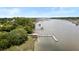 Aerial view showcasing a private boat dock and ramp providing direct access to the river at 2962 Anchor Watch Dr, Wadmalaw Island, SC 29487
