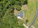 Overhead shot of a large estate with a winding driveway surrounded by lush greenery and manicured lawns at 2962 Anchor Watch Dr, Wadmalaw Island, SC 29487
