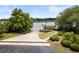 Aerial view of a waterfront property with dock access, mature trees and a scenic view at 2962 Anchor Watch Dr, Wadmalaw Island, SC 29487