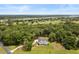Aerial view of a stunning home surrounded by mature trees and green lawns at 2962 Anchor Watch Dr, Wadmalaw Island, SC 29487