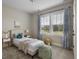 Cozy bedroom with twin bed, accent decor, curtains, and carpeted floors at 2962 Anchor Watch Dr, Wadmalaw Island, SC 29487