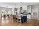 Spacious kitchen with a large island, ample seating, and a dining area is perfect for gatherings and entertaining at 2962 Anchor Watch Dr, Wadmalaw Island, SC 29487