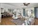 Inviting living room featuring a comfortable seating arrangement and seamless flow to the kitchen and outdoor space at 2962 Anchor Watch Dr, Wadmalaw Island, SC 29487