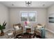 Bright living room featuring wicker chairs, neutral decor, and plenty of natural light at 2962 Anchor Watch Dr, Wadmalaw Island, SC 29487