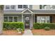 Attractive townhouse with a well-manicured lawn, verdant bushes, and inviting entryway at 402 Pine Bluff Dr, Summerville, SC 29483