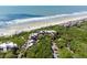 Scenic aerial view capturing beachfront condo community nestled amidst lush trees and bordered by the ocean at 4303 Sea Forest Dr, Kiawah Island, SC 29455