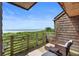 Relax on this balcony with stunning ocean views and cozy wicker seating at 4303 Sea Forest Dr, Kiawah Island, SC 29455