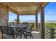 Enjoy ocean views from this covered balcony with an outdoor dining set at 4303 Sea Forest Dr, Kiawah Island, SC 29455