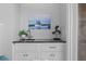 Stylish wet bar with sink, faucet, and storage at 4303 Sea Forest Dr, Kiawah Island, SC 29455