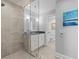 Modern bathroom with a glass-enclosed shower, granite countertop and a serene atmosphere at 4303 Sea Forest Dr, Kiawah Island, SC 29455