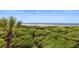 Beautiful beach view with lush greenery in this tropical escape at 4303 Sea Forest Dr, Kiawah Island, SC 29455