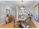 Cozy dining area features a glass table, comfortable seating, stylish decor, and abundant natural light at 4303 Sea Forest Dr, Kiawah Island, SC 29455