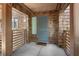Inviting entrance to unit 4303 with wood detailing, railings, and welcome mat at 4303 Sea Forest Dr, Kiawah Island, SC 29455