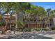 Exterior view of Windswept Villas with trees, sidewalks, stairs, and benches at 4303 Sea Forest Dr, Kiawah Island, SC 29455