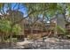 Exterior view of Windswept Villas with mature trees and wood detailing at 4303 Sea Forest Dr, Kiawah Island, SC 29455