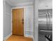Foyer with hardwood floors, coat hooks, and a stainless steel refrigerator at 4303 Sea Forest Dr, Kiawah Island, SC 29455