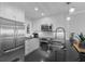 A modern kitchen featuring stainless steel appliances and sleek granite countertops at 4303 Sea Forest Dr, Kiawah Island, SC 29455