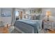 Cozy bedroom with ocean view window, nautical decor and soothing color palette at 4303 Sea Forest Dr, Kiawah Island, SC 29455