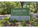 A sign for Windswept Villas features the address range and manicured landscaping at 4303 Sea Forest Dr, Kiawah Island, SC 29455