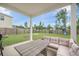 Back porch featuring outdoor seating, a table, and a beautiful view of the backyard and fence at 452 Minim St, Charleston, SC 29414