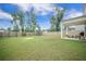 Expansive backyard featuring a wooden fence, a playset, and a furnished patio at 452 Minim St, Charleston, SC 29414