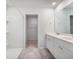 Bright bathroom with double vanity, white cabinetry, and walk-in shower at 452 Minim St, Charleston, SC 29414