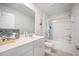 Well-lit bathroom featuring a vanity with white cabinets, framed mirror, and shower-tub combo at 452 Minim St, Charleston, SC 29414