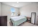 Bright bedroom features a large window, neutral carpet, a side table and stylish furnishings at 452 Minim St, Charleston, SC 29414
