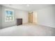 Spacious bedroom features a window and sliding barn door to the Primary bathroom at 452 Minim St, Charleston, SC 29414