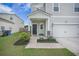 Inviting front entrance with covered porch, tasteful landscaping, and classic exterior details at 452 Minim St, Charleston, SC 29414
