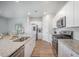 Stylish kitchen featuring granite counters, stainless appliances, and a view to the living area at 452 Minim St, Charleston, SC 29414
