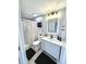 Stylishly updated bathroom with modern vanity, black fixtures, and a shower with patterned curtain at 4649 N U.S. Highway 52, Saint Stephen, SC 29479