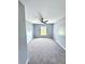 Well-lit bedroom featuring soft carpeting, neutral paint, one window and a modern ceiling fan at 4649 N U.S. Highway 52, Saint Stephen, SC 29479