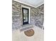 Covered entrance of home with a brick exterior, leading to a front door with a glass window at 4649 N U.S. Highway 52, Saint Stephen, SC 29479