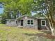 Charming brick single-story home with a manicured lawn and mature trees at 4649 N U.S. Highway 52, Saint Stephen, SC 29479