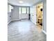 Tile flooring hallway with bright access to the entry door and bathroom at 4649 N U.S. Highway 52, Saint Stephen, SC 29479