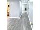 Hallway showcasing tile flooring, neutral paint, and access to a bathroom at 4649 N U.S. Highway 52, Saint Stephen, SC 29479