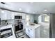 Modern kitchen with stainless steel appliances, white island, and granite countertops at 4649 N U.S. Highway 52, Saint Stephen, SC 29479