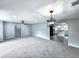 Spacious living room featuring modern lighting and an open floor plan that flows into the kitchen at 4649 N U.S. Highway 52, Saint Stephen, SC 29479