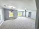 Spacious living room with neutral gray walls, plush carpet, and ample natural light at 4649 N U.S. Highway 52, Saint Stephen, SC 29479