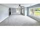 Bright living room with large windows providing plenty of natural light, complemented by neutral walls and carpeting at 4649 N U.S. Highway 52, Saint Stephen, SC 29479