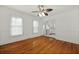 Bedroom featuring wood floors, natural light, and a view of the kitchen at 4735 W Park Pl, North Charleston, SC 29405