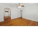 Charming bedroom featuring wood floors, a ceiling fan, and an entry hallway at 4735 W Park Pl, North Charleston, SC 29405